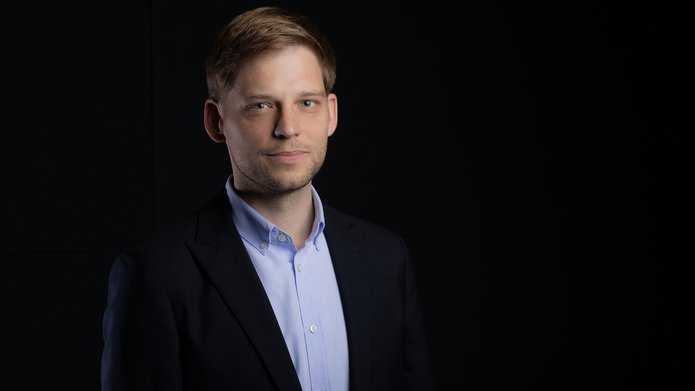 a portrait photo of Prof. Mikołaj Deckert